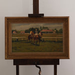 Painting of horses on a grassy field with a wooden frame and stand.