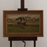 Painting of horses on a grassy field with a wooden frame and stand.
